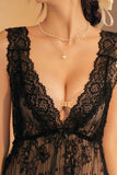 Black Myvelvettouch lace garment with a deep neckline on a neutral background