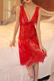Woman wearing a red Myvelvettouch lace nightgown on a bed
