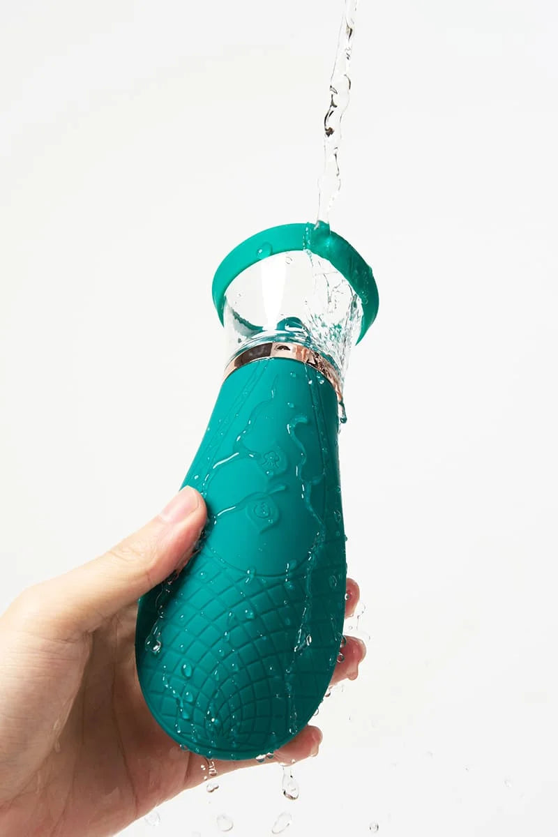 Myvelvettouch Clitoral Suction and Licking Vibrator held by a hand against a white background