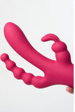 Pink silicone Myvelvettouch Dual Stimulation Rabbit Vibrator with Anal Beads and Vaginal Insertion held by a hand on a white background