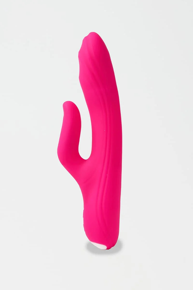 Pink Myvelvettouch G-spot Tapping and Clitoral Stimulation Vibrator on a light gray background