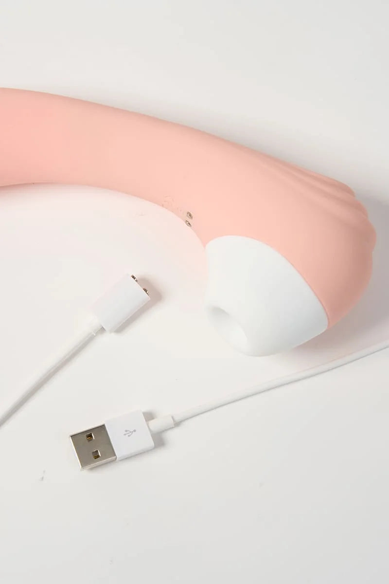 Pink Myvelvettouch Portable 2-in-1 Female Sucking and Vibrator with USB cable on a light gray background