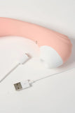 Pink Myvelvettouch Portable 2-in-1 Female Sucking and Vibrator with USB cable on a light gray background