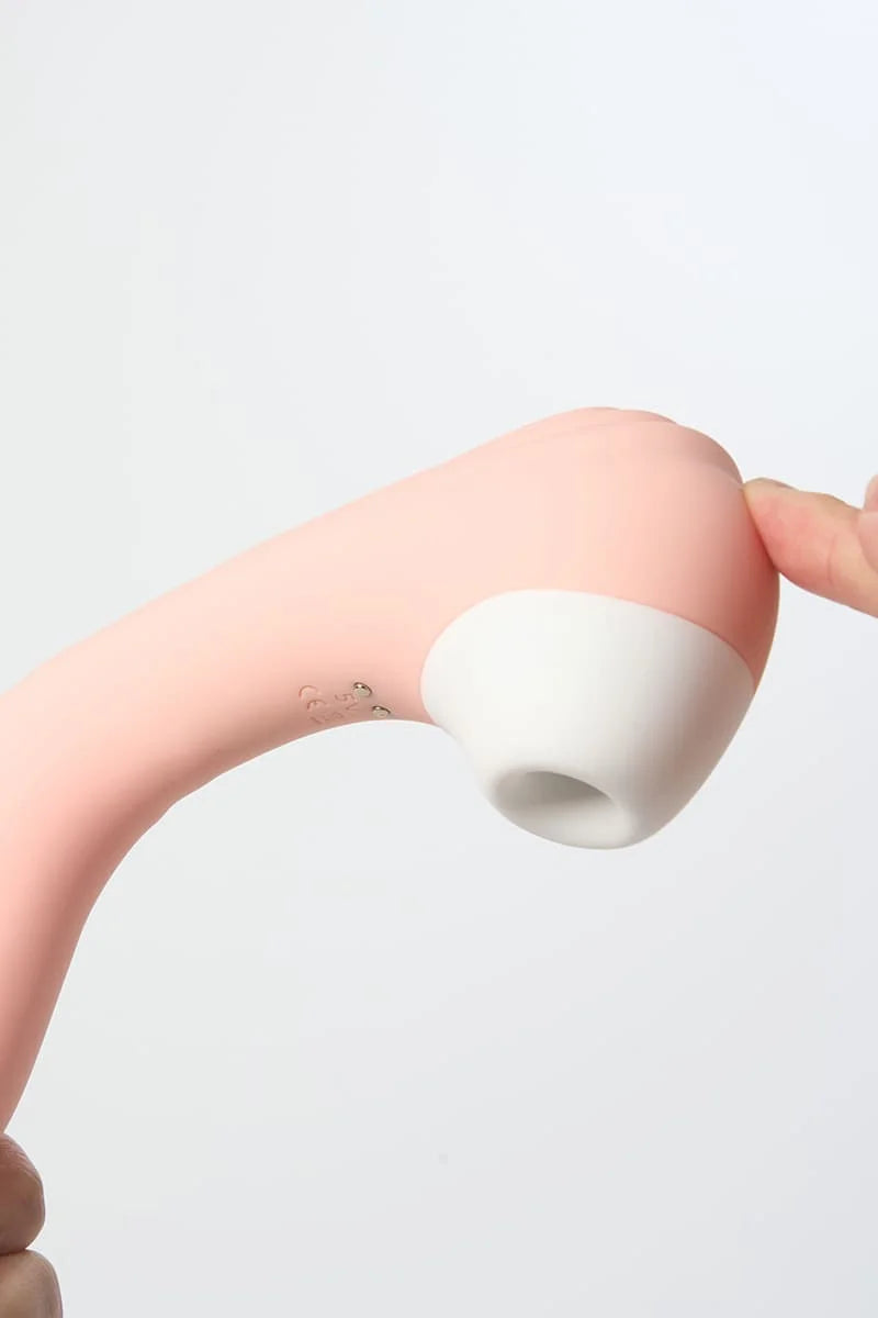 White silicone Myvelvettouch Portable 2-in-1 Female Sucking and Vibrator against a light gray background