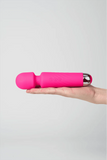 Myvelvettouch Portable Clitoral Stimulator Massager held in a hand against a light gray background