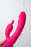 Pink Myvelvettouch Rabbit Clitoral Stimulation and G-spot Slapping Vibrator with water droplets on a white background