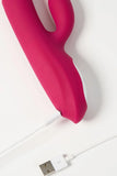 Pink silicone Myvelvettouch Rabbit Clitoral Stimulator and Thrusting Vibrator on a white USB cable with a USB connector.