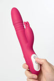 Pink Myvelvettouch Rabbit Clitoral Stimulator and Thrusting Vibrator held by a hand on a white background