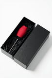 Myvelvettouch Rose Vibrator with Tongue Licking and Clitoral Stimulation with metal handle in a black box on a white background