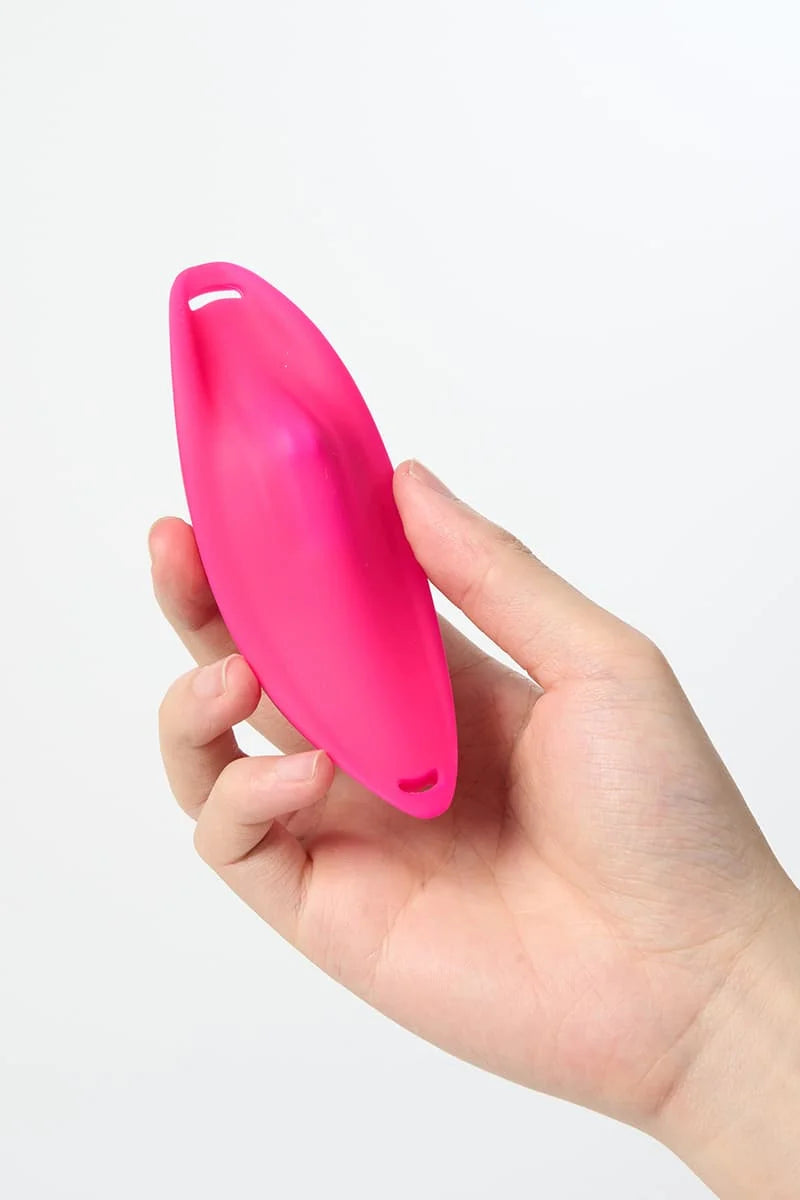Hand holding a pink Myvelvettouch Sexy Underwear Wearable Clitoral Stimulation Vibrator against a white background
