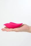 Pink Myvelvettouch Sexy Underwear Wearable Clitoral Stimulation Vibrator held in a hand against a white background