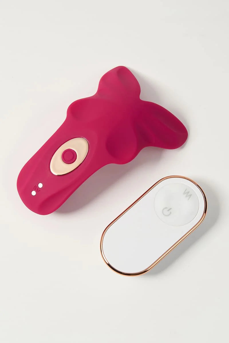 Pink Myvelvettouch Remote control sex toys Panty Vibrator with a white electronic remote control on a light gray background