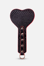 Heart-shaped black paddle with red trim on a white background