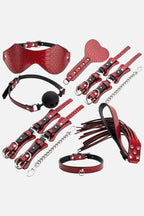 Collection of red Crocodile Texture BDSM Role Play Kit on a white background
