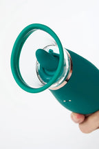 Myvelvettouch Clitoral Suction and Licking Vibrator held by a hand on a white background