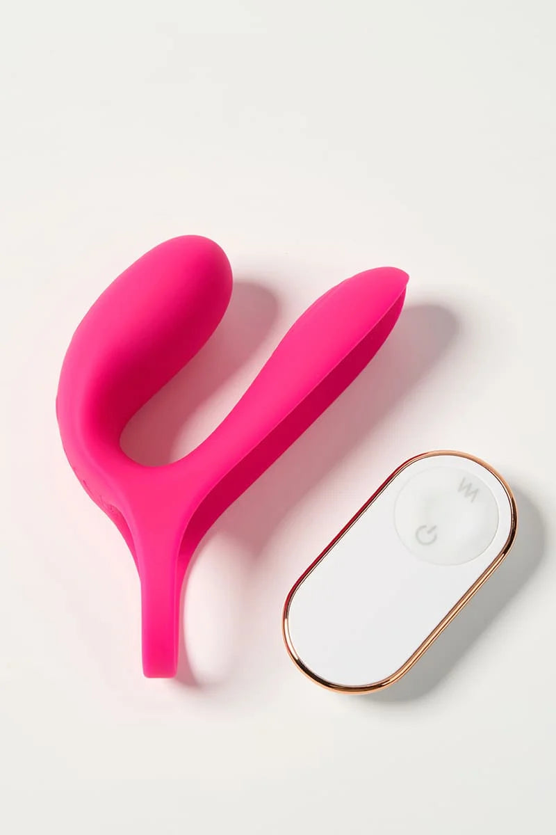 Pink Myvelvettouch Cock Ring and Remote Control Couple Vibrator and white electronic controller on a light pink background Main image