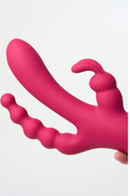Pink silicone Myvelvettouch Dual Stimulation Rabbit Vibrator with Anal Beads and Vaginal Insertion held by a hand on a white background