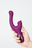 Myvelvettouch Elegant Purple G-Spot and Clitoral Sucking Vibrator 2-in-1 held in a hand against a light gray background