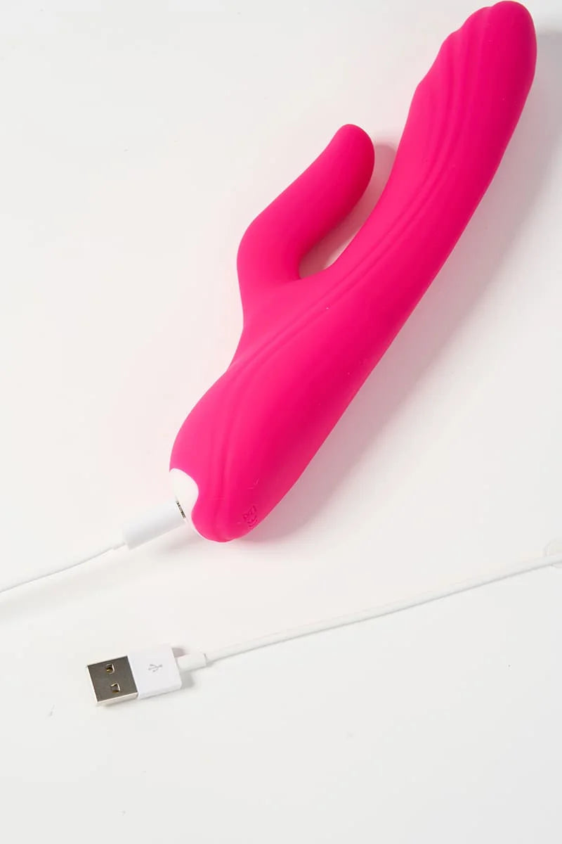 Pink silicone Myvelvettouch G-spot Tapping and Clitoral Stimulation Vibrator with USB cable on a white background