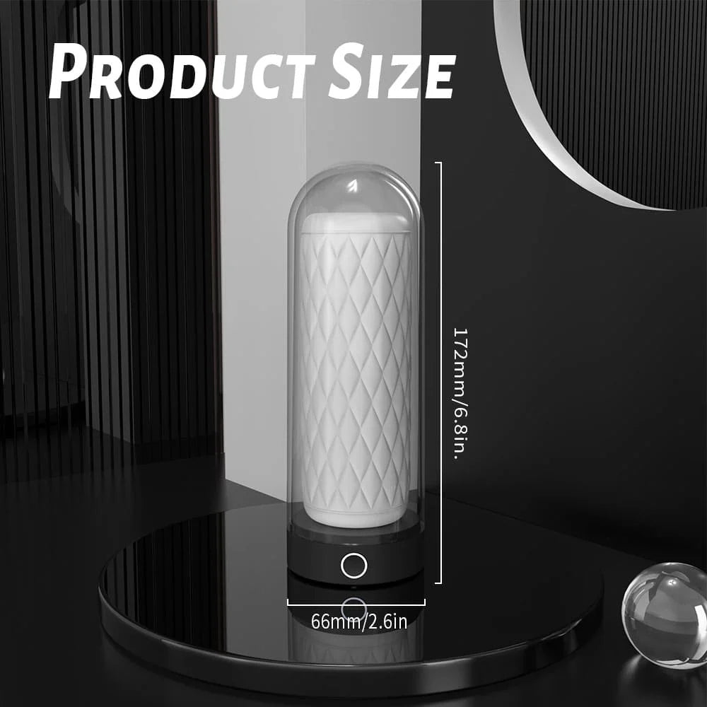 Product size measurement of a Myvelvettouch Heated Masturbation Cup with a textured pattern, enclosed in a glass dome on a black stand.