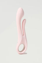 Pink silicone Myvelvettouch Multifunctional Clitoral Stimulator Dual Head Vibrator on a light gray background