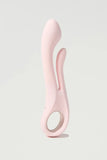 Pink silicone Myvelvettouch Multifunctional Clitoral Stimulator Dual Head Vibrator on a light gray background