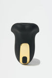Black and gold Myvelvettouch Penis Trainer on a white background