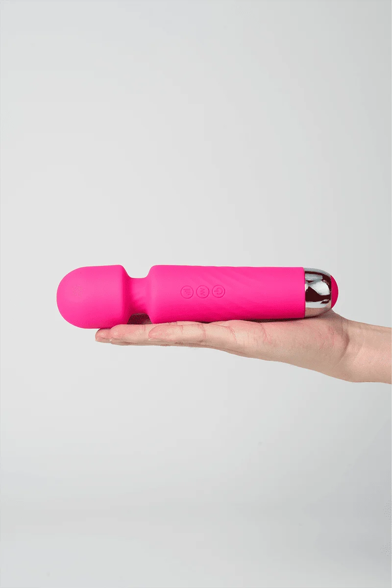 Myvelvettouch Portable Clitoral Stimulator Massager held in a hand against a light gray background