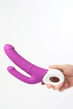 Purple and white Myvelvettouch Realistic Dildo with G-spot Vibration and Anal Prostate Anal Plug Vibration held by a hand on a white background