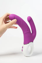 Purple and white Myvelvettouch Realistic Dildo with G-spot Vibration and Anal Prostate Anal Plug Vibration held by a hand on a white background