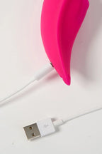 Pink Myvelvettouch Sexy Underwear Wearable Clitoral Stimulation Vibratorwhite USB cable on a light pink background