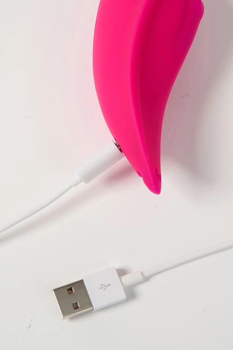 Pink Myvelvettouch Sexy Underwear Wearable Clitoral Stimulation Vibratorwhite USB cable on a light pink background