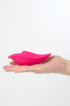 Pink Myvelvettouch Sexy Underwear Wearable Clitoral Stimulation Vibrator held in a hand against a white background