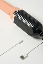 Myvelvettouch Suction Cup Vibrating Dildo with Thrusting and Remote Control with a USB cable on a white background