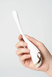 Hand holding Myvelvettouch Swan Neck G-spot Stimulator Vibrator against a light gray background