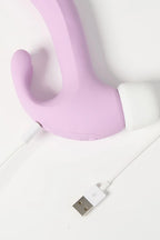 Purple Myvelvettouch Rabbit 3-in-1 Tapping and Sucking Vibrator with a USB cable on a white background
