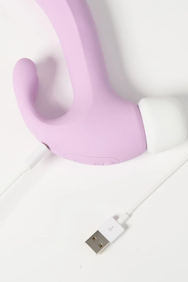 Purple Myvelvettouch Rabbit 3-in-1 Tapping and Sucking Vibrator with a USB cable on a white background