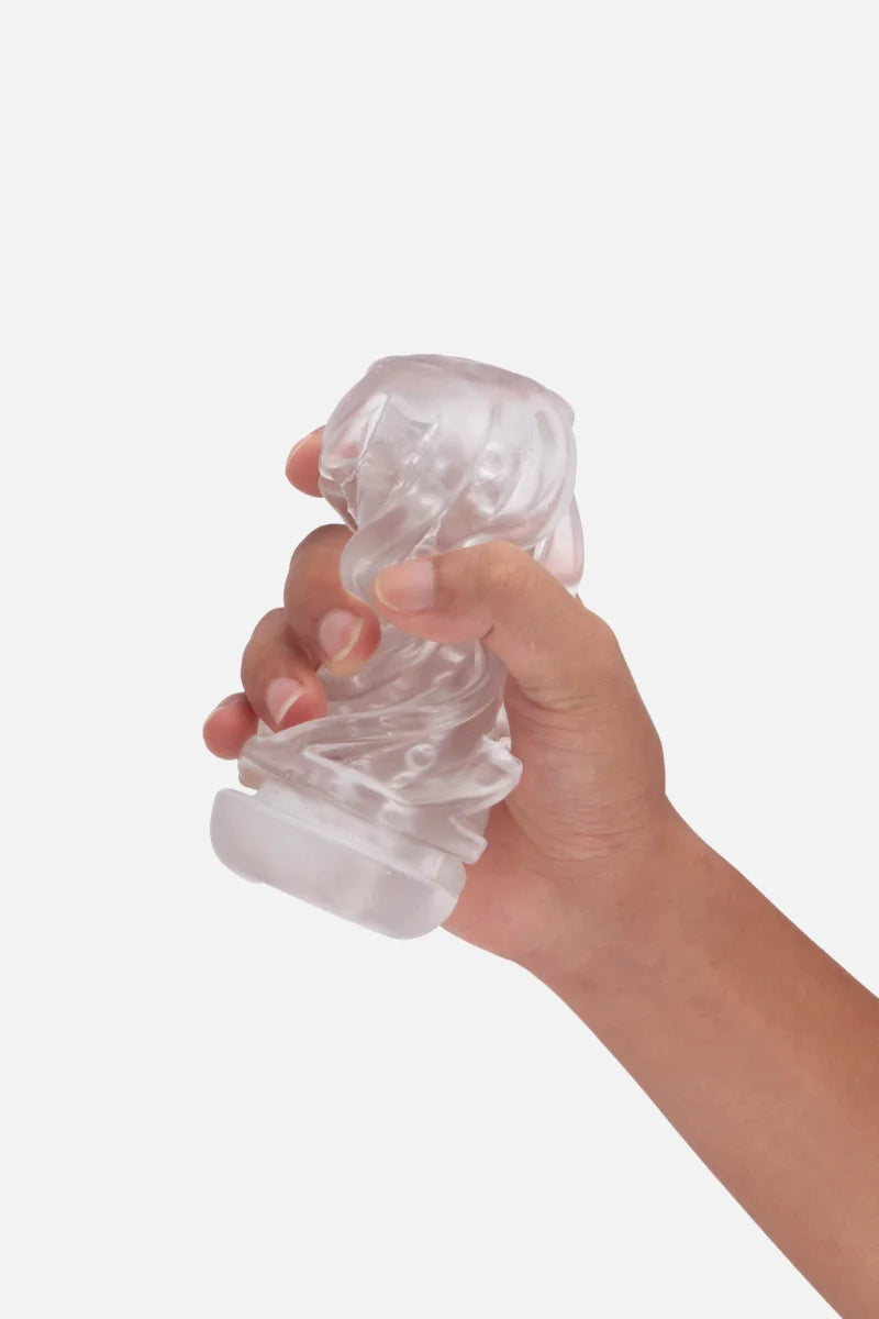 Hand holding a clear inside of Suction Cup Automatic Sucking Vibration Voice Aircraft Cup against a white background