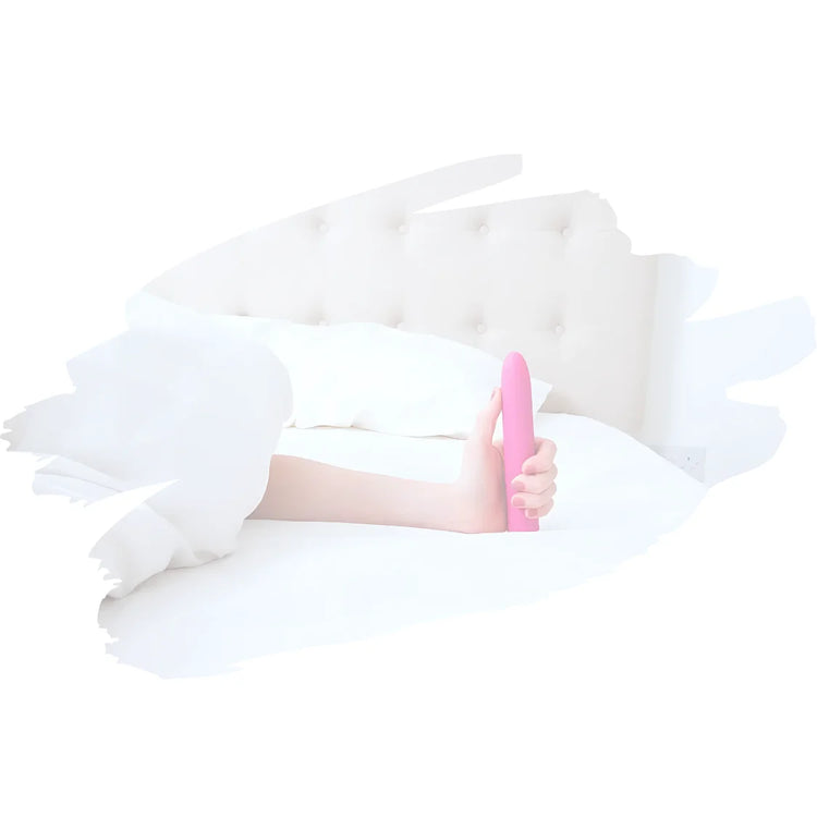 White inflatable chair with a person lying on it against a white background with a pink vibrator in the hand