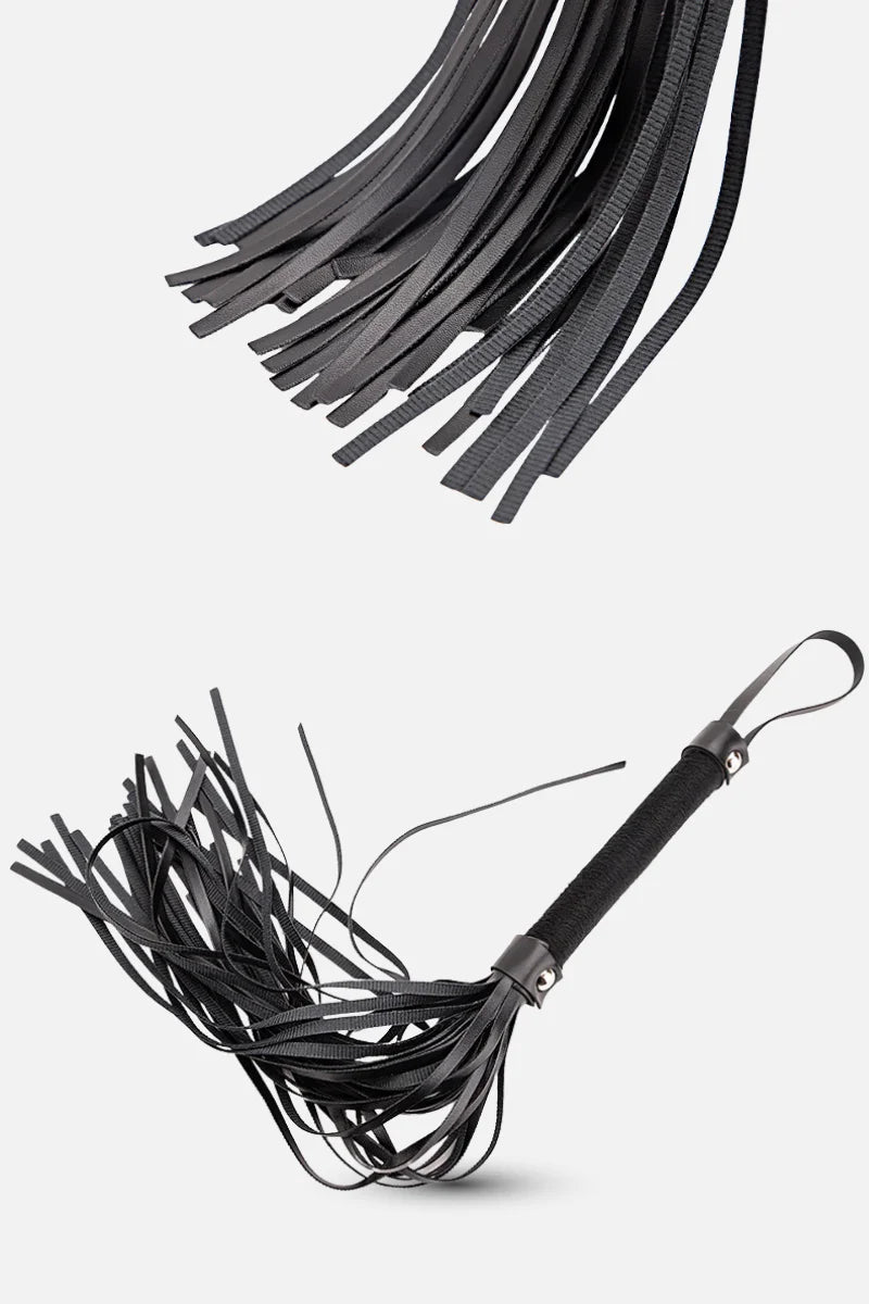 Black leather whip on a white background