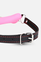 Silicone Bone Gag with Adjustable Strap with red stitching and a pink handle on a white background
